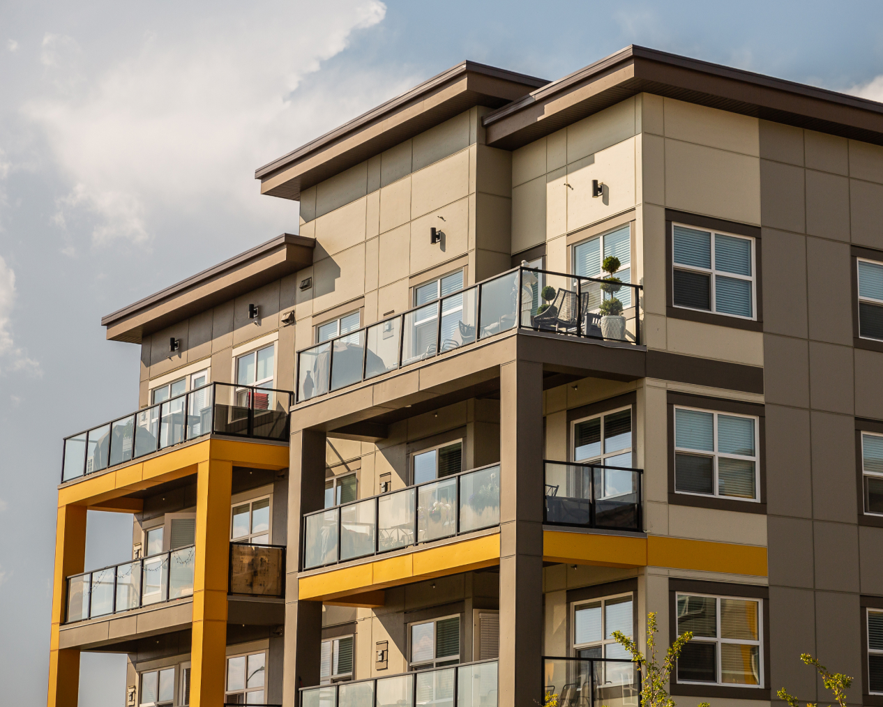 A yellow and beige apartment building with EasyTrim siding.